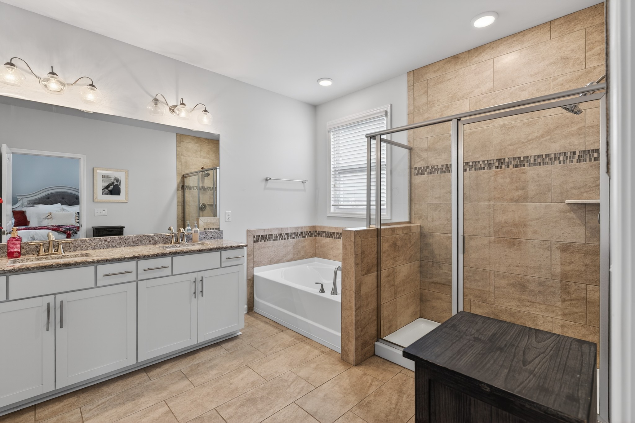 306 William Dylan Drive Murfreesboro, TN 37129 - Photo 22 of 47 a spacious bathroom with a granite countertop sink mirror and a bath tub