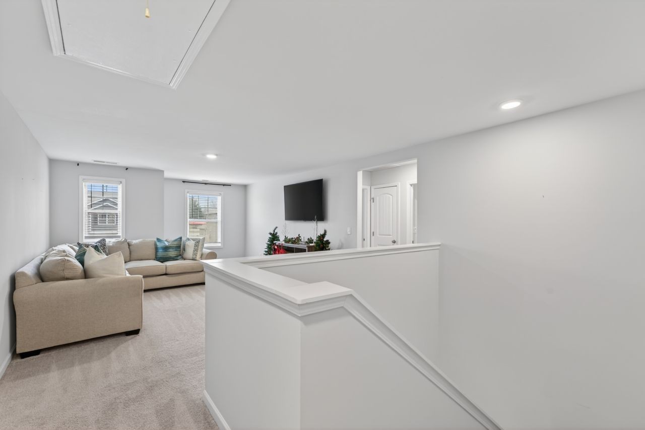 306 William Dylan Drive Murfreesboro, TN 37129 - Photo 23 of 47 a living room with furniture and a flat screen tv