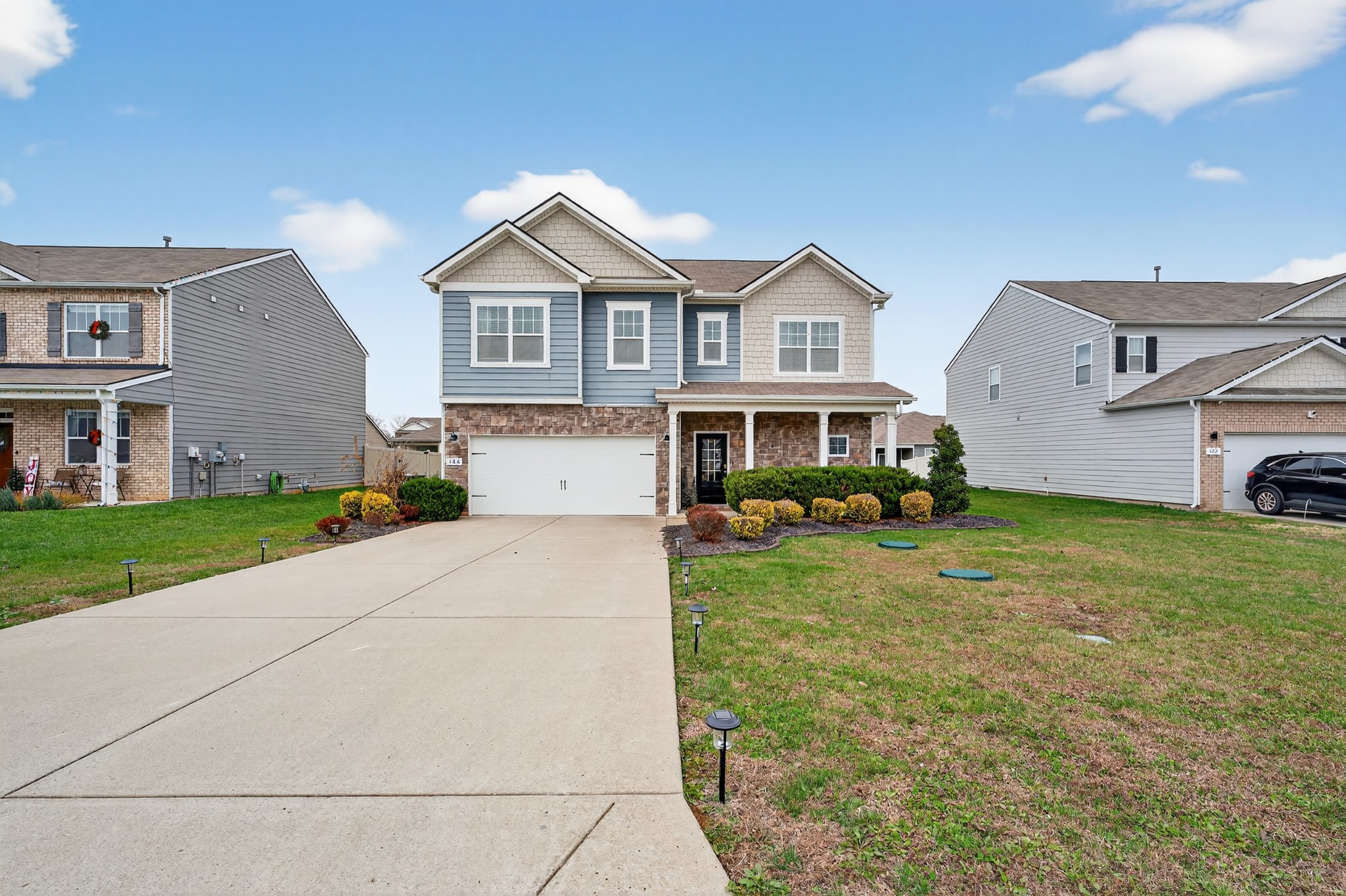 306 William Dylan Drive Murfreesboro, TN 37129 - Photo 42 of 47 a front view of a house with a yard and garage