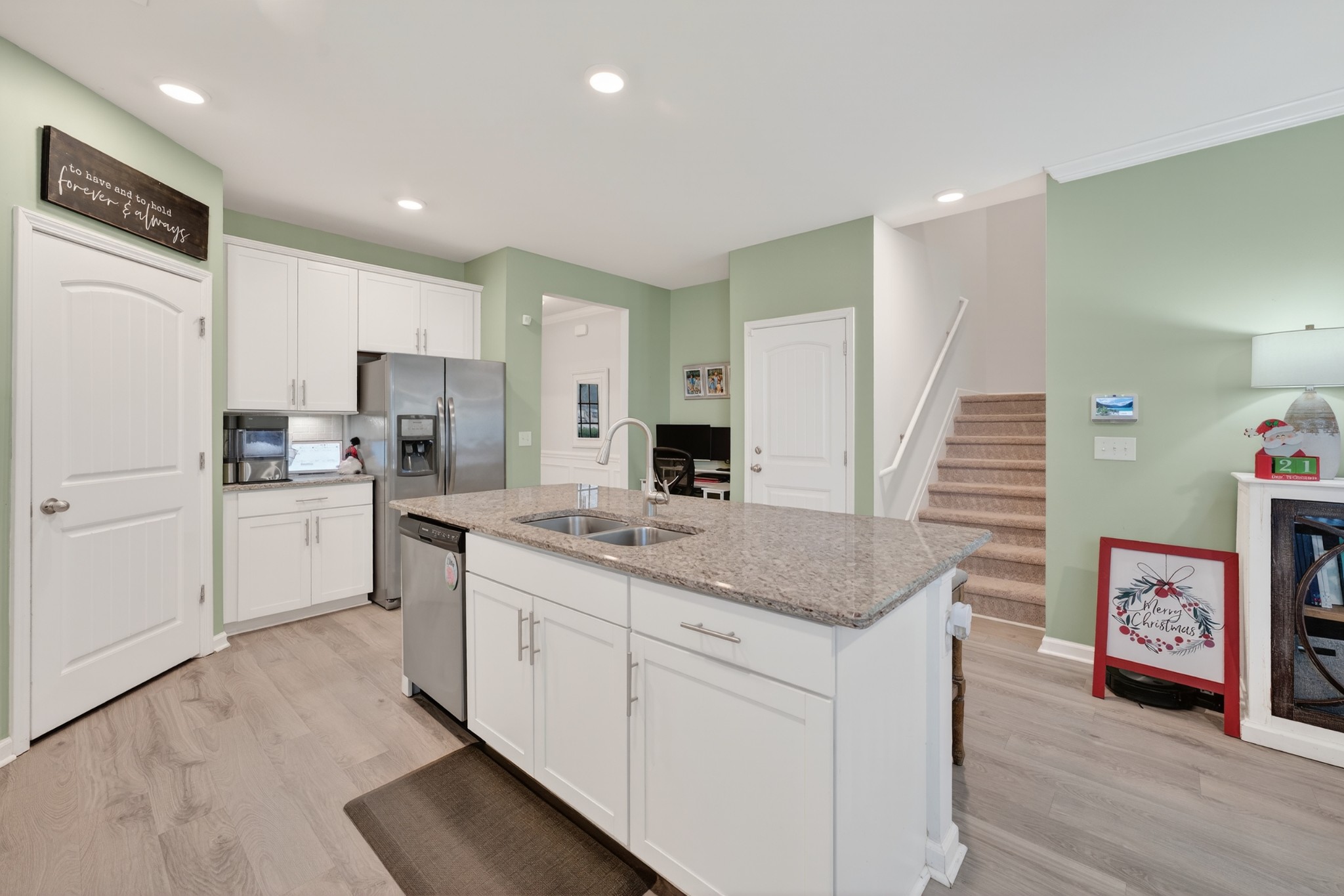 306 William Dylan Drive Murfreesboro, TN 37129 - Photo 9 of 47 a kitchen with white cabinets and sink