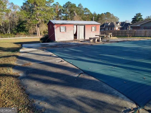 a view of house with yard