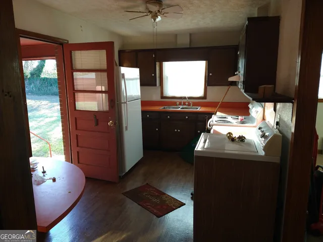 a kitchen with a sink and a stove