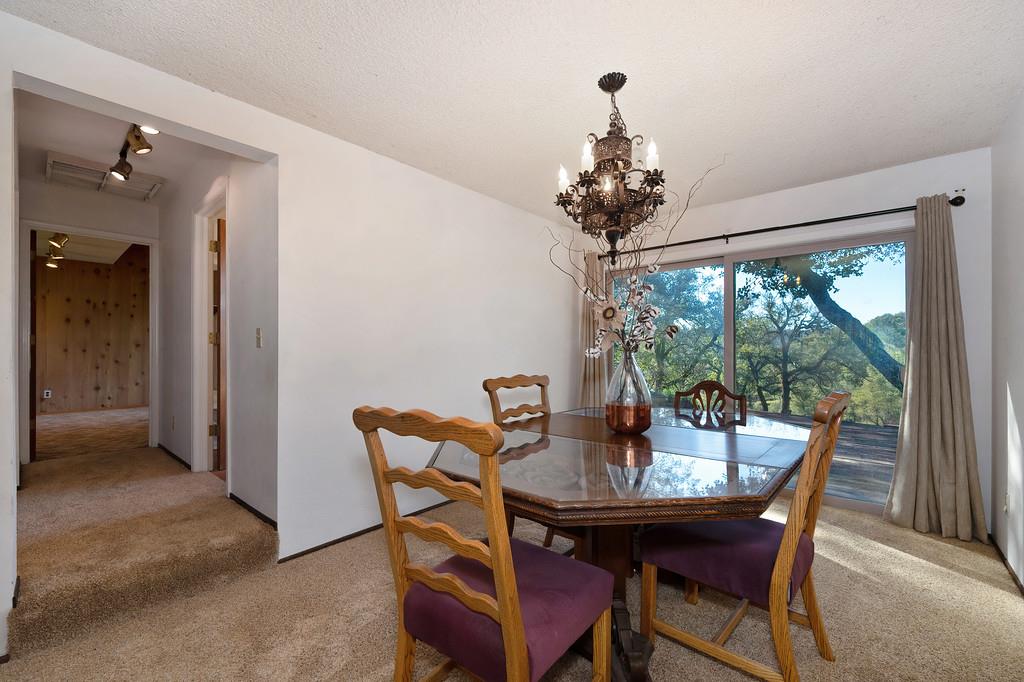 4656 Cosumnes View Trail Placerville, CA 95667 - Photo 14 of 58 a dining room with furniture a chandelier and window