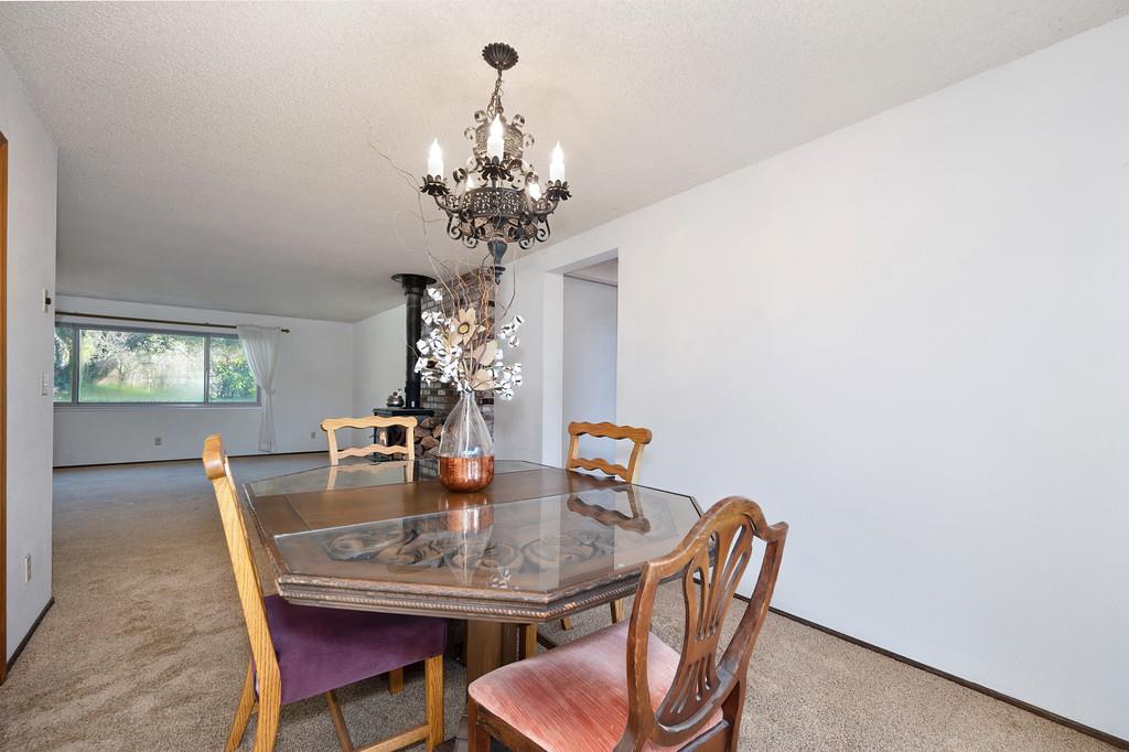 4656 Cosumnes View Trail Placerville, CA 95667 - Photo 15 of 58 a dining room with furniture a chandelier and window