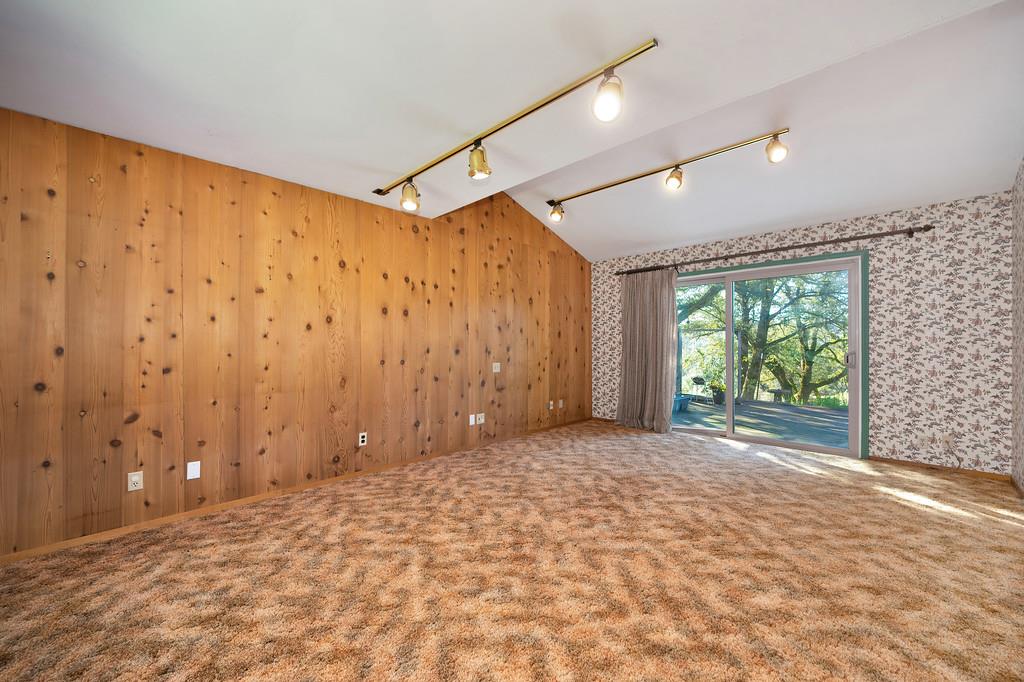 4656 Cosumnes View Trail Placerville, CA 95667 - Photo 23 of 58 a view of empty room with wooden floor and fan