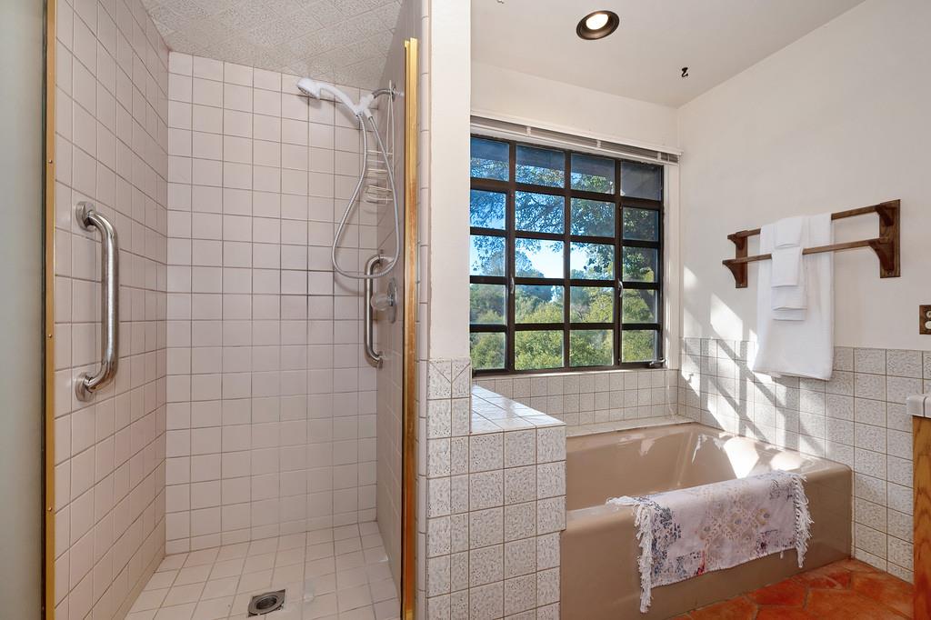 4656 Cosumnes View Trail Placerville, CA 95667 - Photo 29 of 58 a bathroom with a bathtub and shower