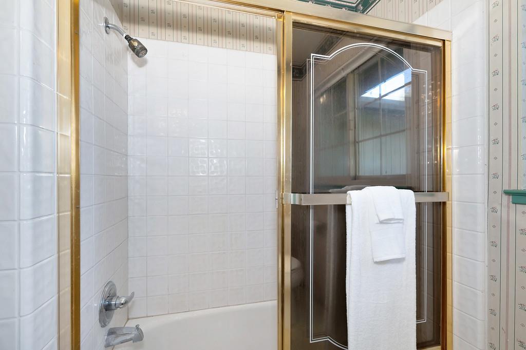 4656 Cosumnes View Trail Placerville, CA 95667 - Photo 35 of 58 a bathroom with a shower and a mirror