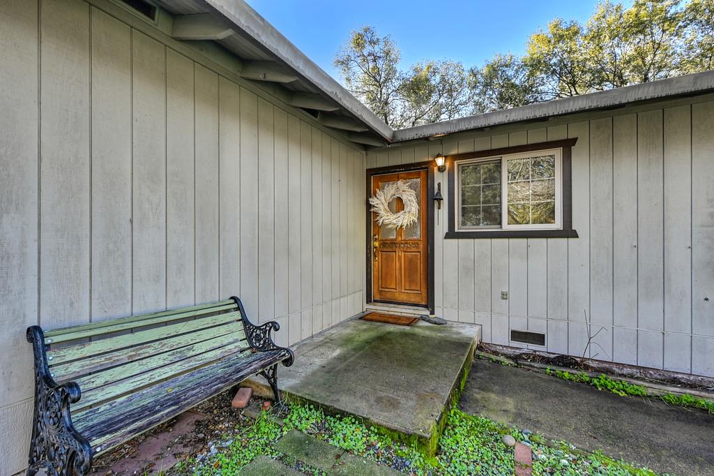 4656 Cosumnes View Trail Placerville, CA 95667 - Photo 8 of 58 a backyard of a house with a table and chairs