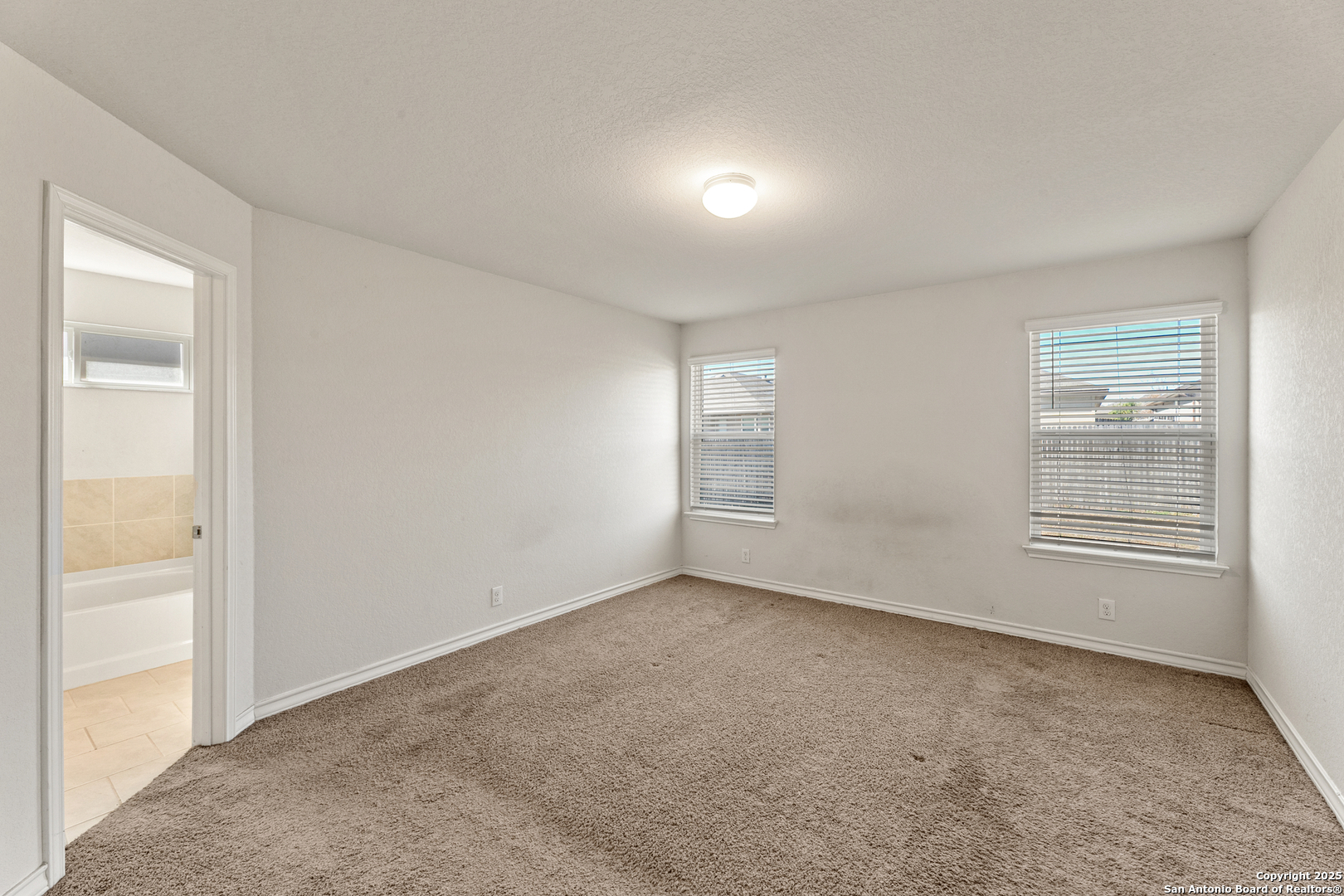 9711 Bratten Rise San Antonio, TX 78254 - Photo 13 of 19 an empty room with windows