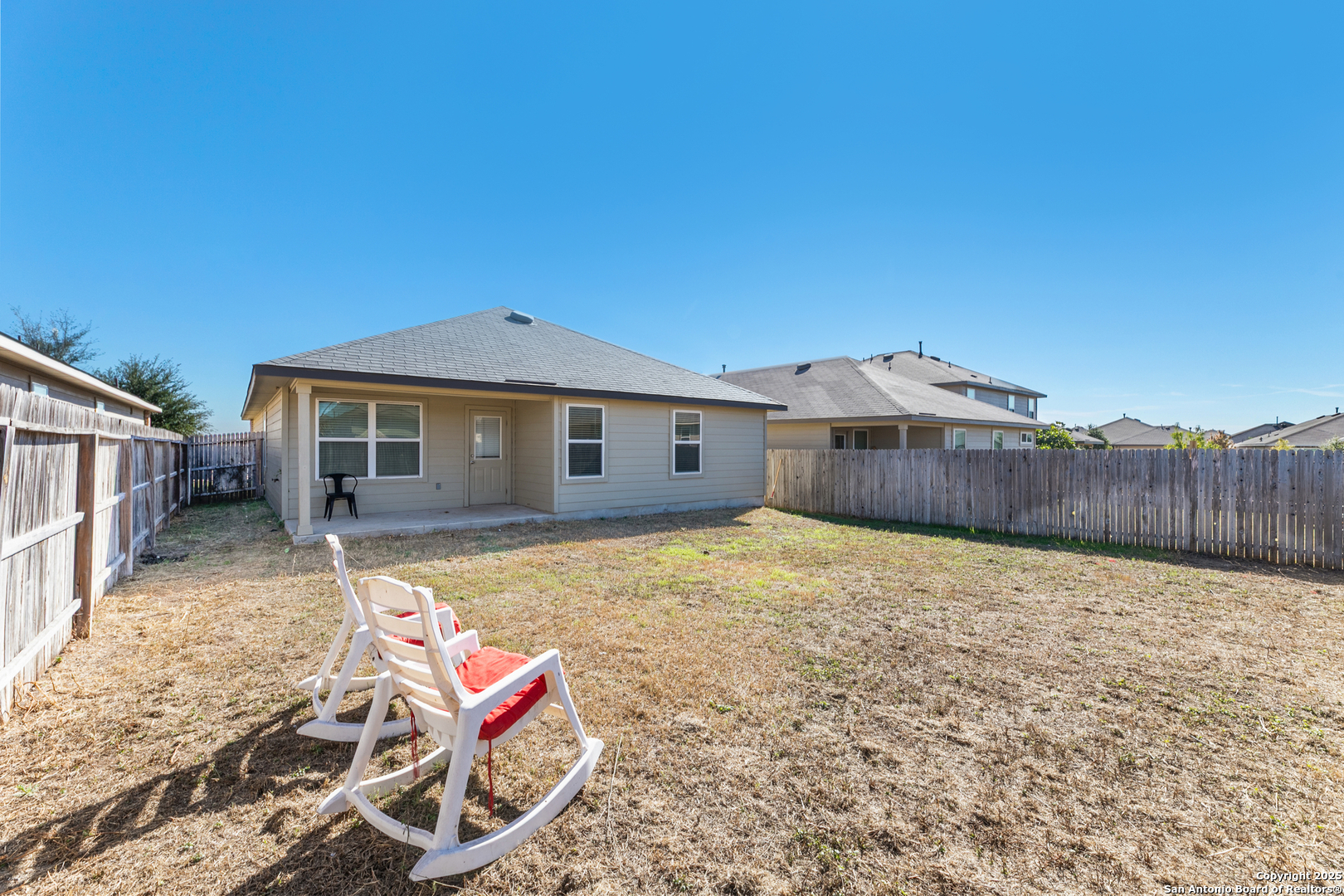 9711 Bratten Rise San Antonio, TX 78254 - Photo 19 of 19 a backyard of a house with table and chairs