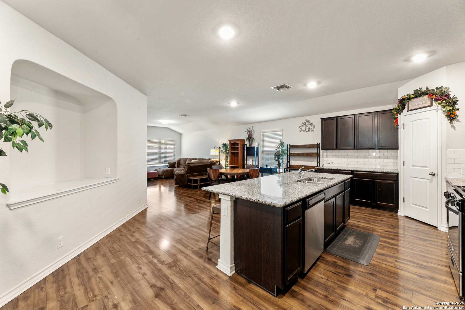 9711 Bratten Rise San Antonio, TX 78254 - Photo 3 of 19 a kitchen with a stove and a sink