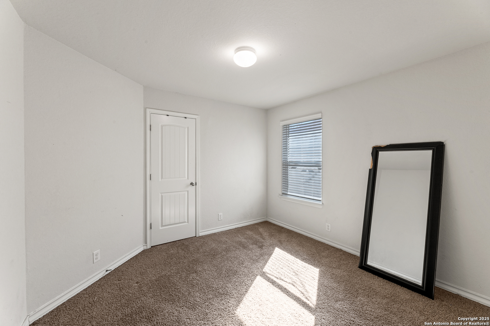 9711 Bratten Rise San Antonio, TX 78254 - Photo 8 of 19 a view of livingroom with hardwood floor and window