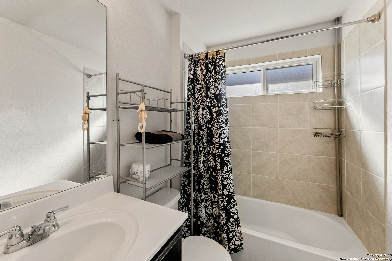 9711 Bratten Rise San Antonio, TX 78254 - Photo 9 of 19 a bathroom with a bathtub a sink and a shower