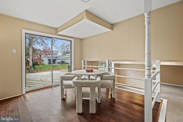 a living room with a couch and a floor to ceiling window