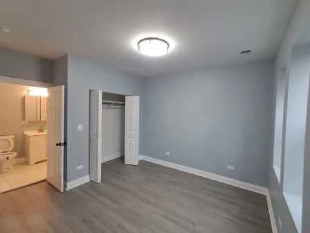 a kitchen with stainless steel appliances a refrigerator and a stove