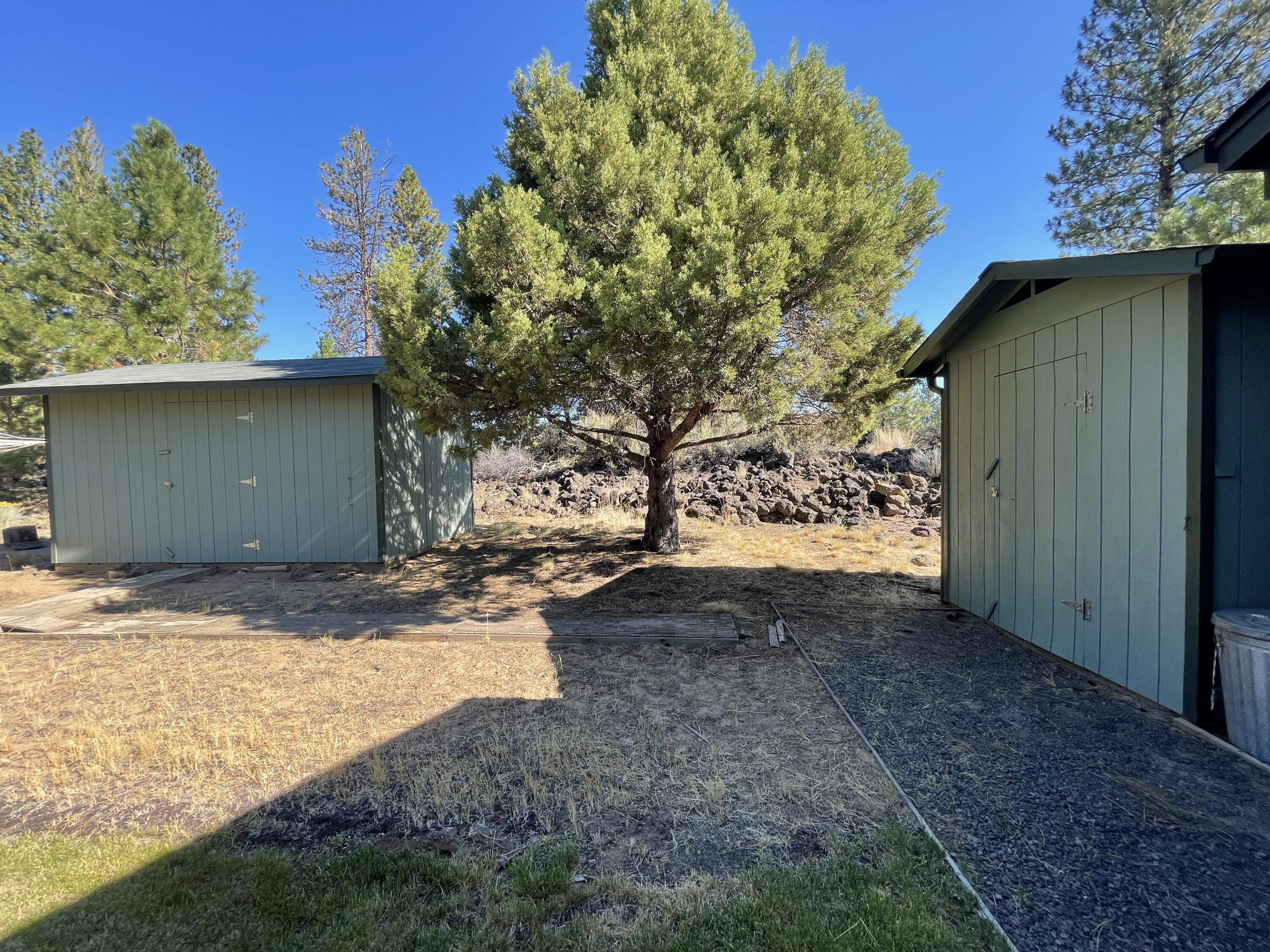 19761 Buck Canyon Road Bend, OR 97702 - Photo 24 of 33 Storage sheds on north side of house