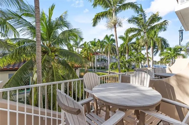 a view of a chair and table in the balcony