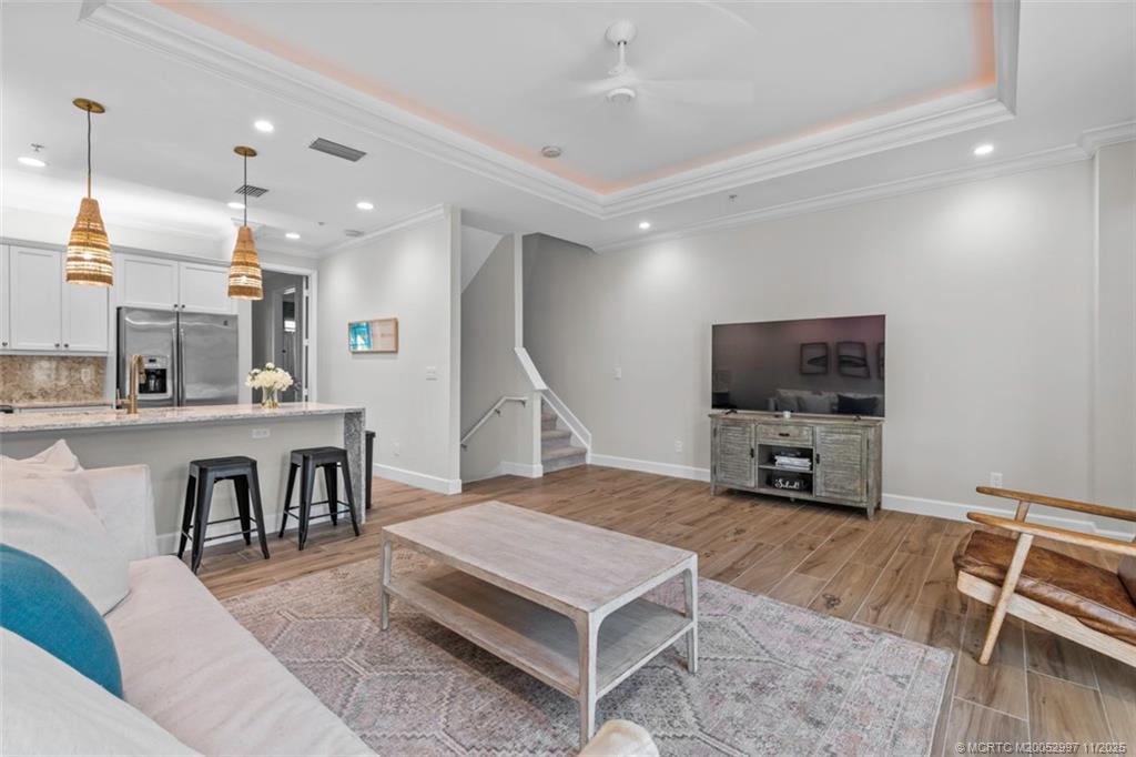 1577 Bow Line Road Fort Pierce, FL 34949 - Photo 15 of 49 a living room with furniture a flat screen tv and kitchen view