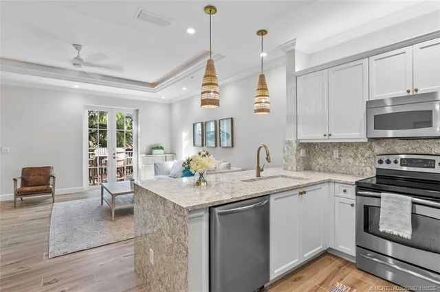 a kitchen with a sink stove and cabinets