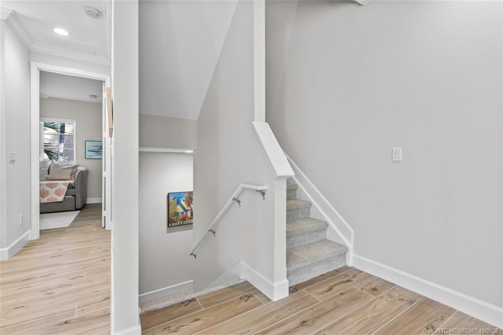 1577 Bow Line Road Fort Pierce, FL 34949 - Photo 21 of 49 a view of entryway with wooden floor and stairs