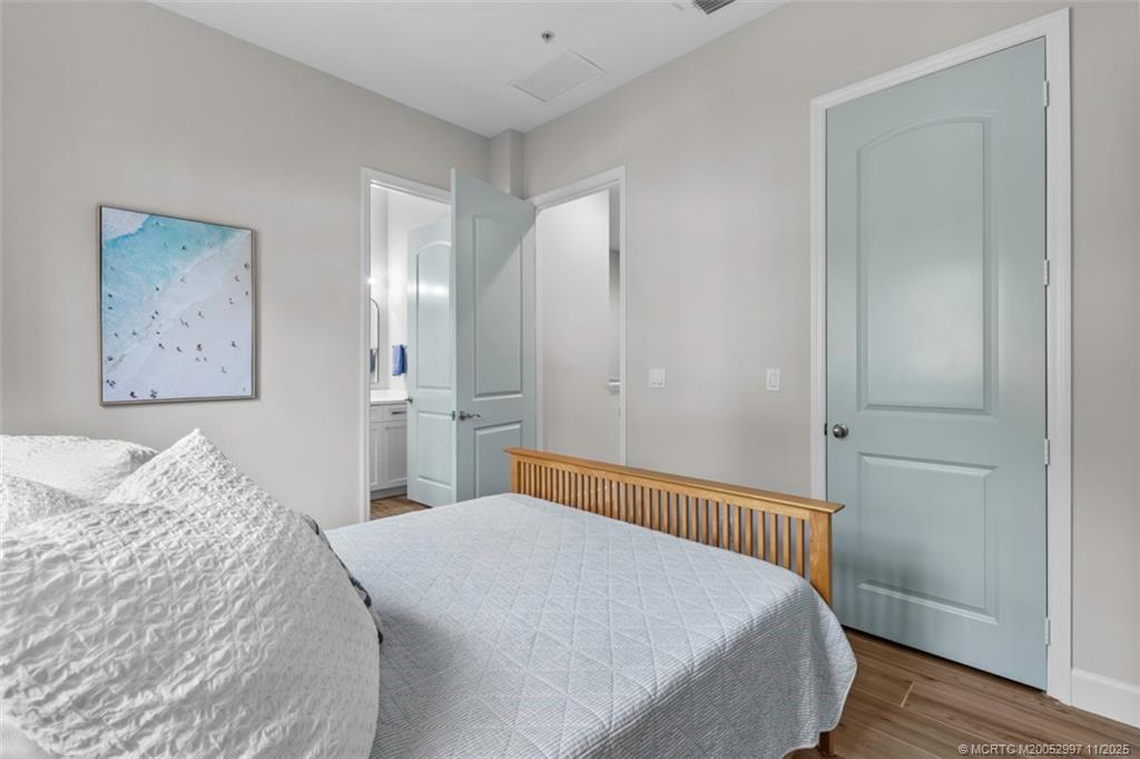 1577 Bow Line Road Fort Pierce, FL 34949 - Photo 24 of 49 a bedroom with a large bed and a walk in closet