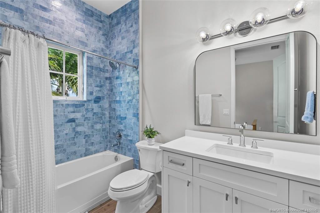 1577 Bow Line Road Fort Pierce, FL 34949 - Photo 25 of 49 a bathroom with a sink a toilet a tub and shower