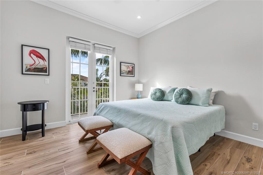 1577 Bow Line Road Fort Pierce, FL 34949 - Photo 27 of 49 a bedroom with a bed and wooden floor