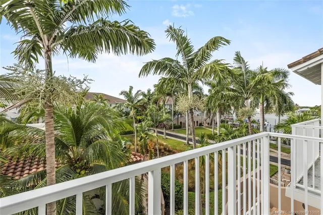 a view of a balcony with a tree