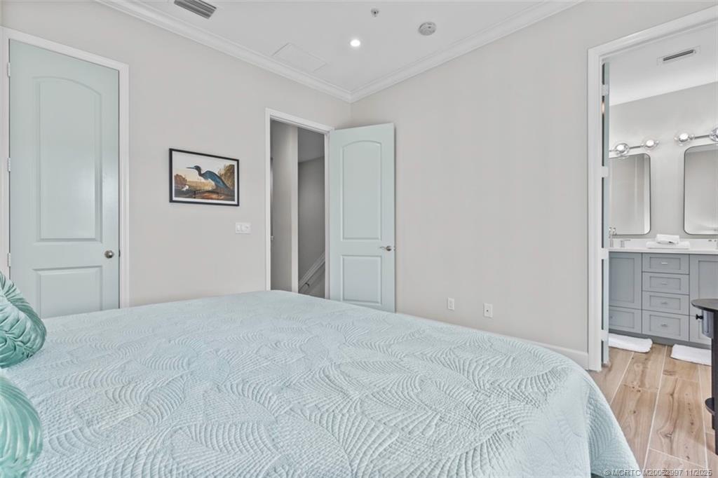 1577 Bow Line Road Fort Pierce, FL 34949 - Photo 29 of 49 a bedroom with a bed and a view of kitchen