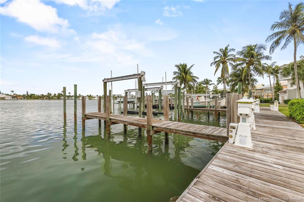 1577 Bow Line Road Fort Pierce, FL 34949 - Photo 36 of 49 a view of a lake with a outdoor seating