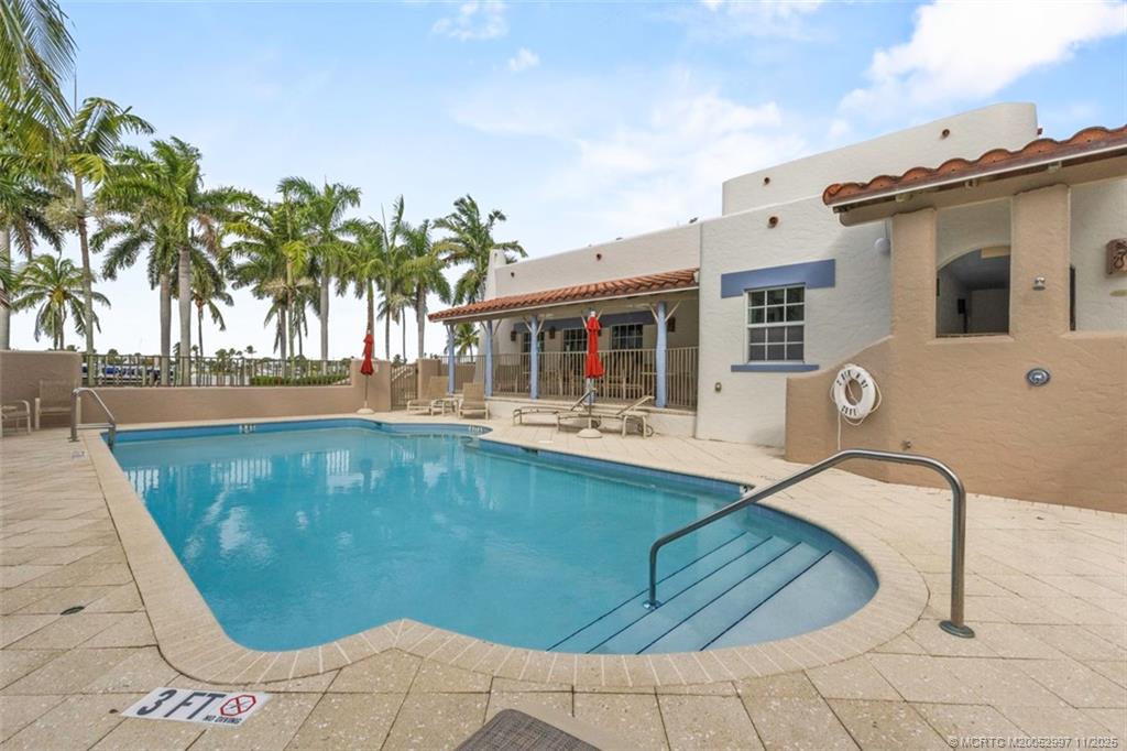 1577 Bow Line Road Fort Pierce, FL 34949 - Photo 40 of 49 a view of a swimming pool with a lounge chairs