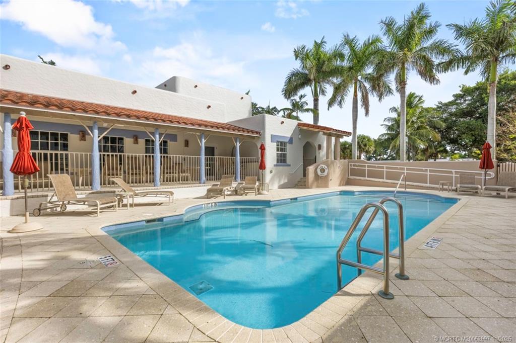 1577 Bow Line Road Fort Pierce, FL 34949 - Photo 41 of 49 a view of a swimming pool with a lounge chair
