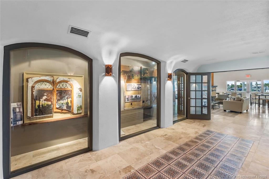 1577 Bow Line Road Fort Pierce, FL 34949 - Photo 42 of 49 a lobby with furniture and a glass door
