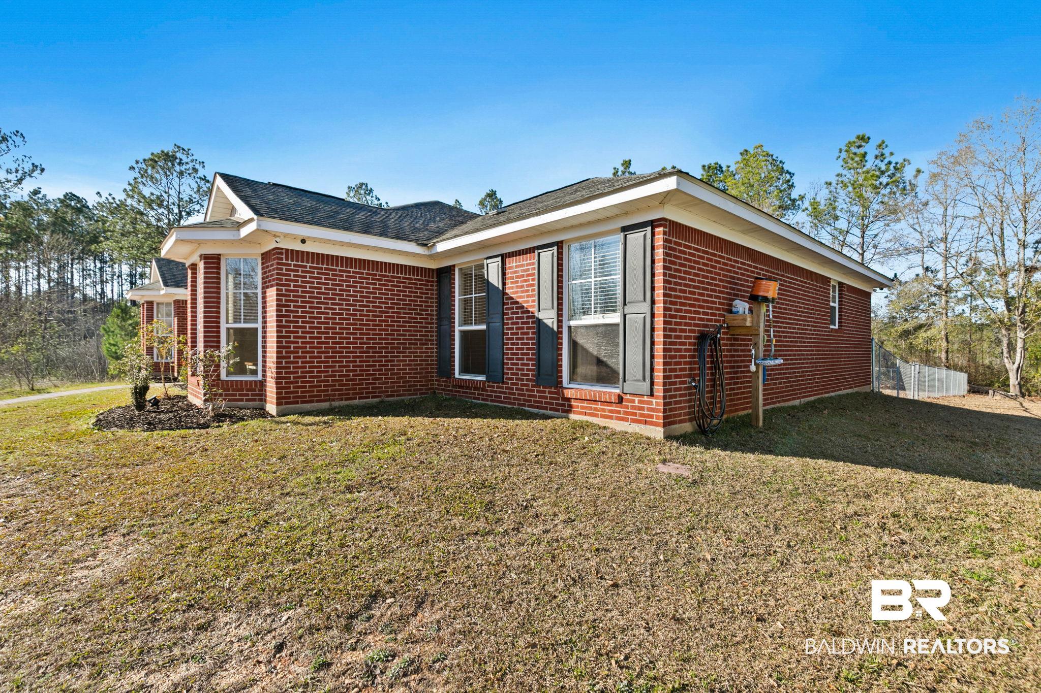 55750 Lottie Road Perdido, AL 36562 - Photo 31 of 84 View of property exterior featuring brick siding