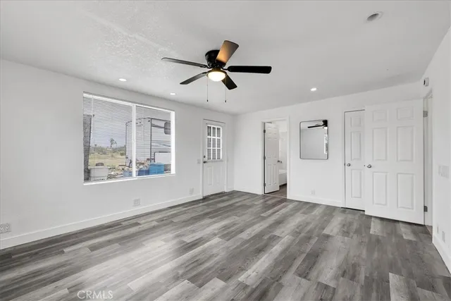 a bathroom with a tub a sink and a window