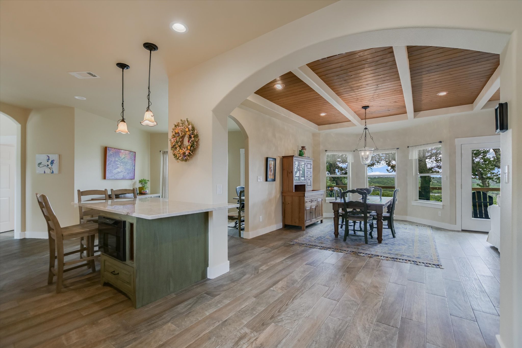 590 Rancho Grande Drive Wimberley, TX 78676 - Photo 9 of 30 a view of a dining room with furniture and wooden floor