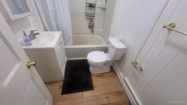 a bathroom with a sink and toilet
