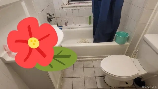 a bathroom with a toilet and a sink