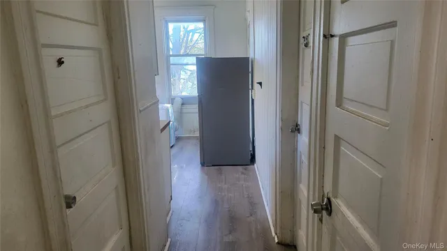 a view of a kitchen from the hallway