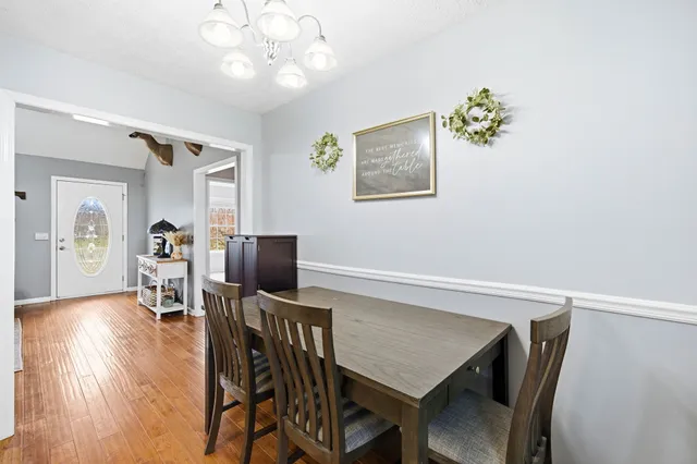 a bedroom with furniture and a wooden floor