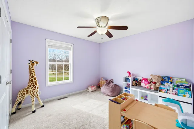 a bedroom with a bed and cabinets