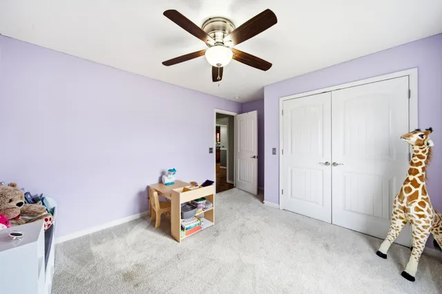 a bedroom with furniture and windows