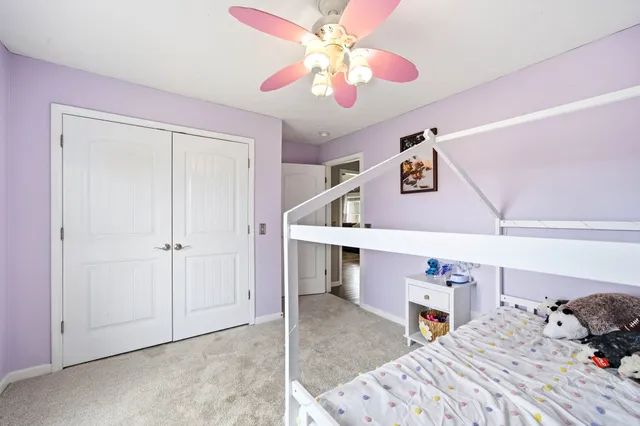 a bathroom with a sink a toilet and shower curtain