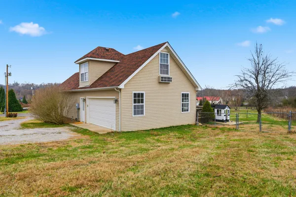 a view of a house with a big yard
