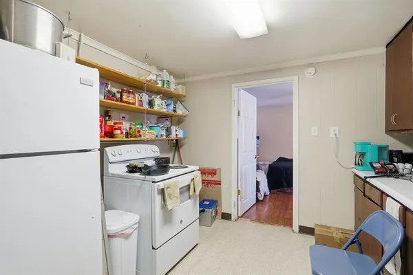 a kitchen that has a sink and a stove in it