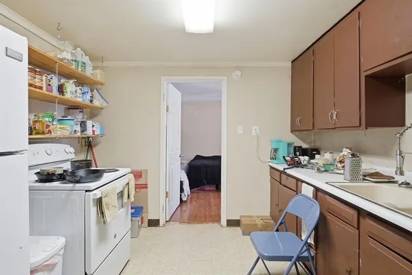 a bedroom with bed and a window