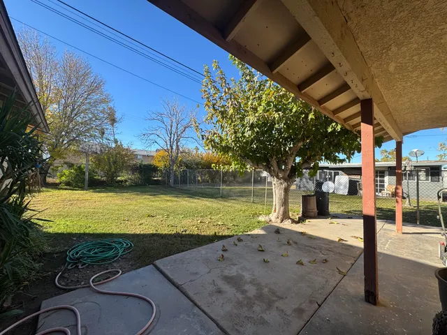 a swimming pool with lots of tress in front of it