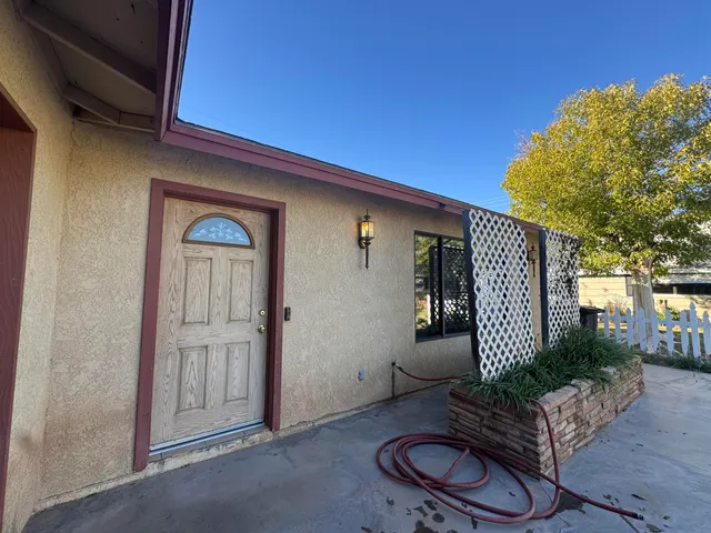 a front view of a house with outdoor seating