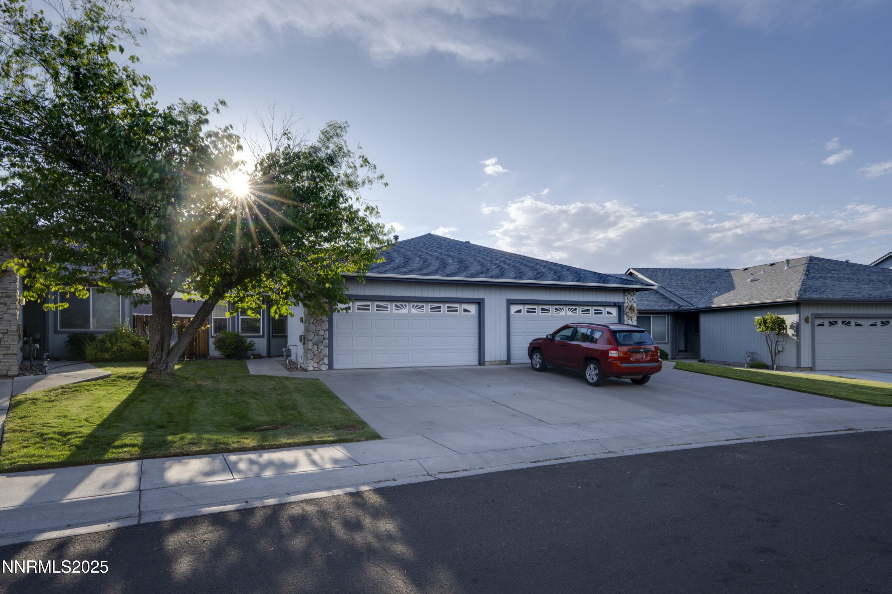 a view of car parked in front of house