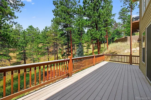 a view of balcony with wooden floor